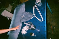 a blue table with clothes on it