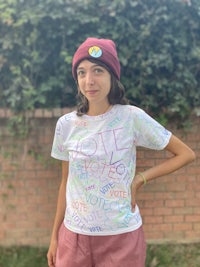 a girl wearing a t - shirt with words written on it