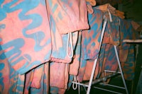 a rack of clothes hanging in a room